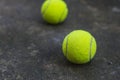 Tennis ball on the dirty ground