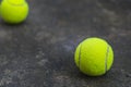 Tennis ball on the dirty ground