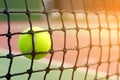 Tennis ball hitting to net on blur court background Royalty Free Stock Photo