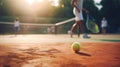 Tennis ball lies orange court. Yellow game ball close up. Sport court background