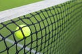Tennis ball in the net Royalty Free Stock Photo