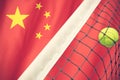 Tennis ball in net on flag China Royalty Free Stock Photo