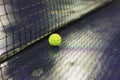 Tennis ball and net on wet ground after raining Royalty Free Stock Photo