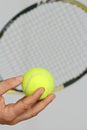 Tennis ball and preparing to make a service Royalty Free Stock Photo