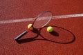 Tennis ball, racket and line on an outdoor court Royalty Free Stock Photo