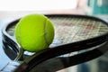 Tennis ball on a racket