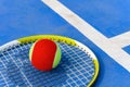 Tennis ball and racket in outdoor court Royalty Free Stock Photo