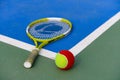 tennis ball and racket in outdoor court Royalty Free Stock Photo