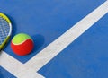 Tennis ball and racket in an outdoor court with copy space Royalty Free Stock Photo