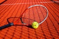 Tennis ball and racket on an outdoor court Royalty Free Stock Photo