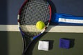 Tennis ball, racket, wristbands on tennis court Royalty Free Stock Photo