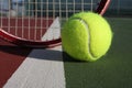 Tennis ball and racquet