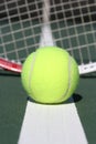 Tennis ball with racquet background Royalty Free Stock Photo