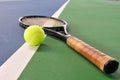 Tennis ball and racquet on a court line Royalty Free Stock Photo