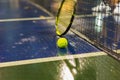 Tennis ball, racquet and net on wet ground after raining Royalty Free Stock Photo