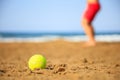 Tennis ball on a sandy beach