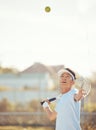 Tennis ball, serving and competitive sports man training or playing a match of game with a racket on an outdoor court Royalty Free Stock Photo