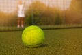 Tennis ball and silhouette of tennis player in sammer day Royalty Free Stock Photo