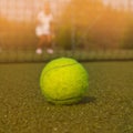 Tennis ball and silhouette of tennis player at sammer Royalty Free Stock Photo