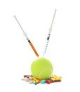 Tennis ball with syringes and different pills on white background. Doping concept Royalty Free Stock Photo