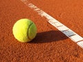 Tennis ball on a tennis court Royalty Free Stock Photo