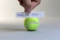 Tennis ball word written on a piece of paper, Bola de Tenis in Spanish language