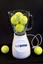Tennis balls in blender Royalty Free Stock Photo