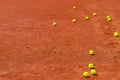 Tennis balls on clay court Royalty Free Stock Photo