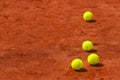 Tennis balls on clay court Royalty Free Stock Photo