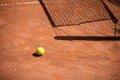 Tennis balls on the ground of clay court Royalty Free Stock Photo