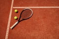 Tennis balls and racket on red dross Royalty Free Stock Photo