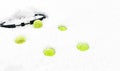 Tennis balls and racket on white snow winter background. Merry Christmas and New year concept with tennis balls play. Close up, Royalty Free Stock Photo