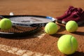 Tennis balls, rackets and shoes on clay court, closeup Royalty Free Stock Photo