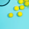 Tennis balls and racquet close up on blue tennis court. Royalty Free Stock Photo