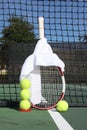 Tennis balls, racquet and net Royalty Free Stock Photo