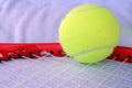 Tennis balls on a racquet. Tennis equipment. New tennis balls. Royalty Free Stock Photo