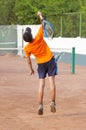 Tennis. boy is serving Royalty Free Stock Photo