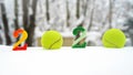 Tennis Christmas and 2020 New Year concept with tennis balls and candles with numbers on white snow, isolated Royalty Free Stock Photo