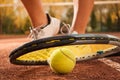 Tennis concept with ball, netting, racket and woman feet Royalty Free Stock Photo