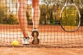 Tennis concept with ball, netting, racket and woman legs Royalty Free Stock Photo