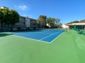 Tennis court inside typical condo community tennis club