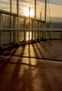 Tennis court net on a cruise ship in late afternoon sunlight. Royalty Free Stock Photo