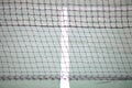 Tennis court net and white intersecting lines