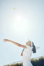 Tennis court, outdoor girl and ball in sky after professional hit with sports racket in match. Woman champion Royalty Free Stock Photo