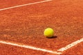 Tennis court. Tennis ball on a clay court near the line Royalty Free Stock Photo