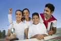 Tennis Family at net on tennis court daughter holding trophy portrait Royalty Free Stock Photo