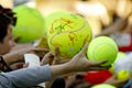 Tennis fans hold a ball