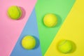 Tennis layout with tennis balls on abstract pastel pink blue yellow green background. Royalty Free Stock Photo