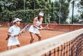 Tennis lesson - instructor working with child