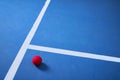 Tennis is life. one red tennis ball lying on a blue tennis court. Royalty Free Stock Photo